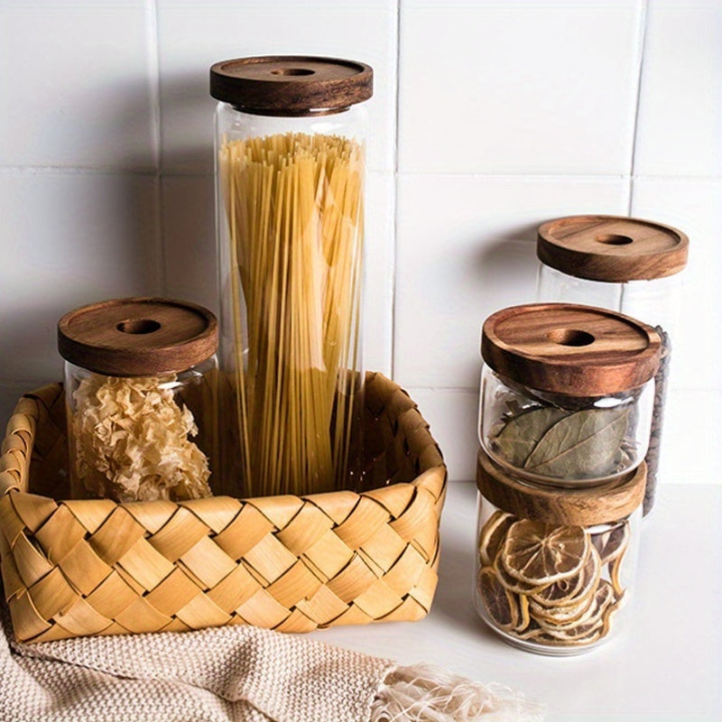 A Set of Four Airtight Glass Jars in Various Sizes for Storage, Ideal for Organizing The Kitchen. This Spice Storage Set Includes Containers for Seasonings, Coffee, And More, Featuring Transparency, High-Temperature Resistance