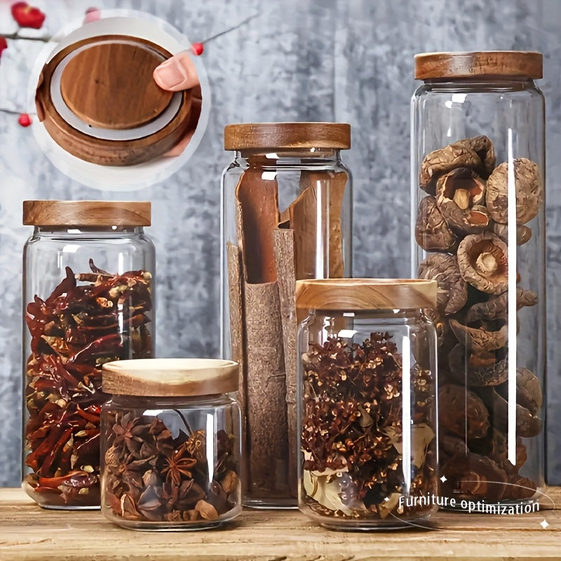 A Set of Four Airtight Glass Jars in Various Sizes for Storage, Ideal for Organizing The Kitchen. This Spice Storage Set Includes Containers for Seasonings, Coffee, And More, Featuring Transparency, High-Temperature Resistance
